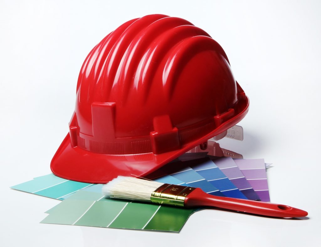 Color pallete with brushes and hard hat